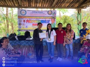first picture: man talking in front of a group of people; second picture: awarding of certificate to the man with three women posing for a picture